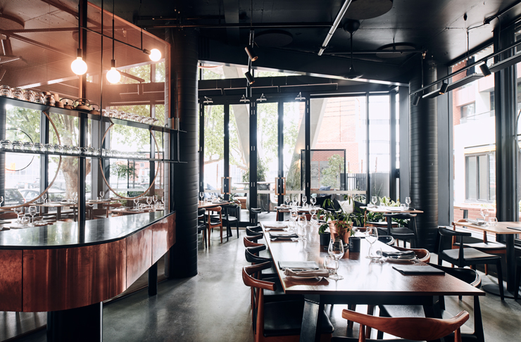 A large industrial style dining room of one of the best Richmond restaurants. 