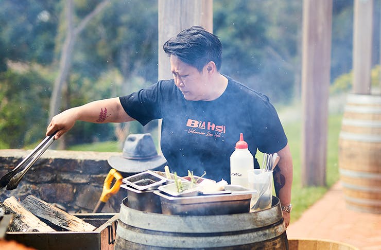 Chef Jerry Mai cooking on an outdoor bbq.