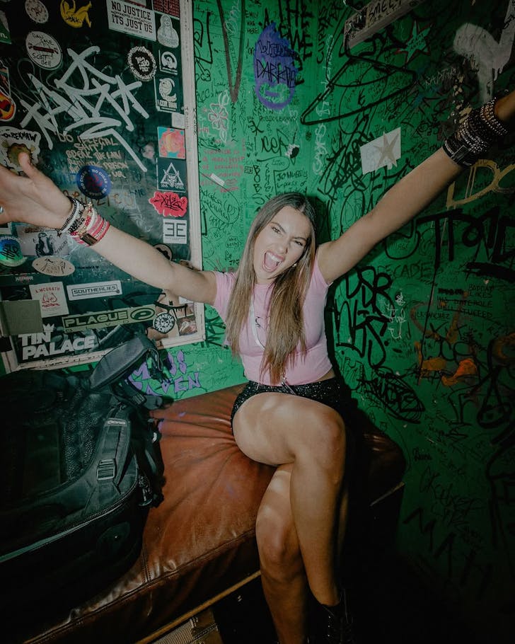 [Dani Josie in the green room/part of a basement venue.]