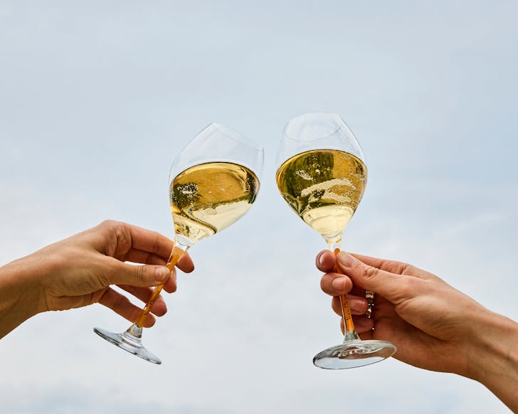 Cheersing glasses of Veuve Cliquot