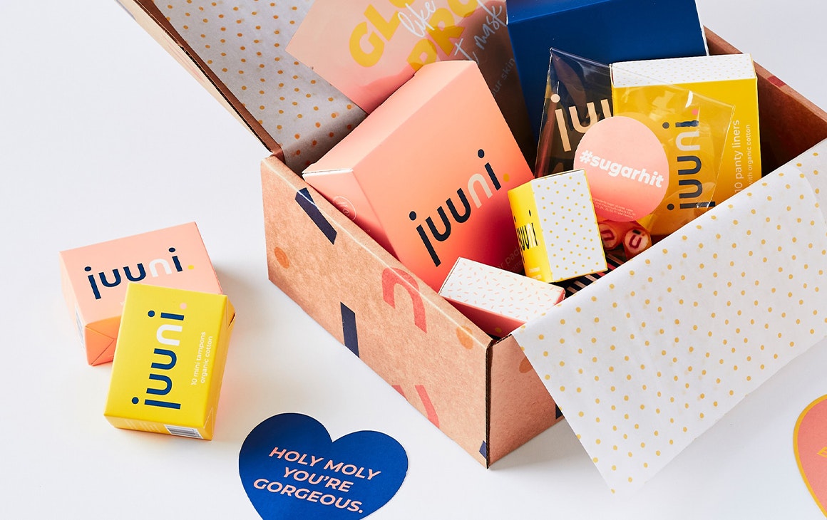 tampons and pads in a cardboard delivery box