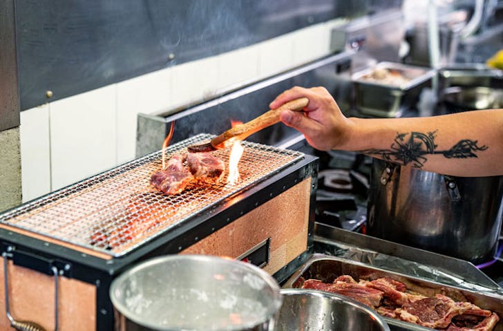 Meat on the grill at Kaiza Izakya. 