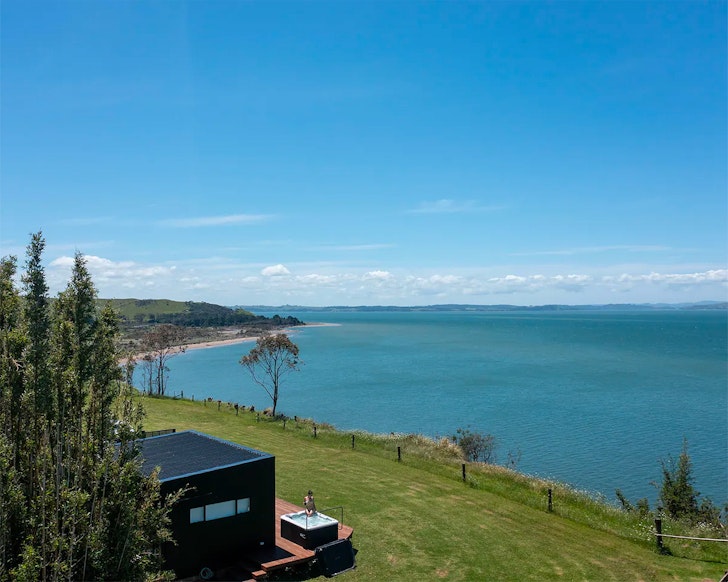 An aerial view of Kapia Lodge by the sea, one of the best romantic stays near Auckland