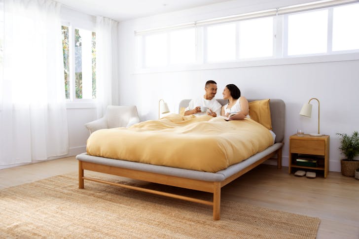 a couple sitting in a bed