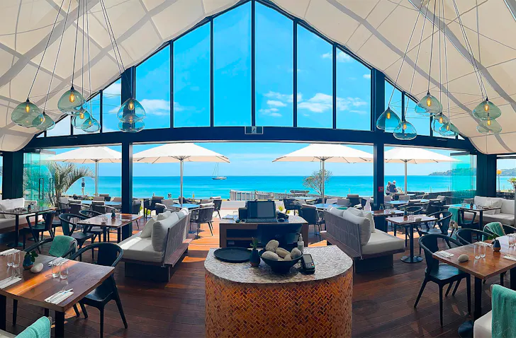 The interior of Ki Māha looks out over the sea.