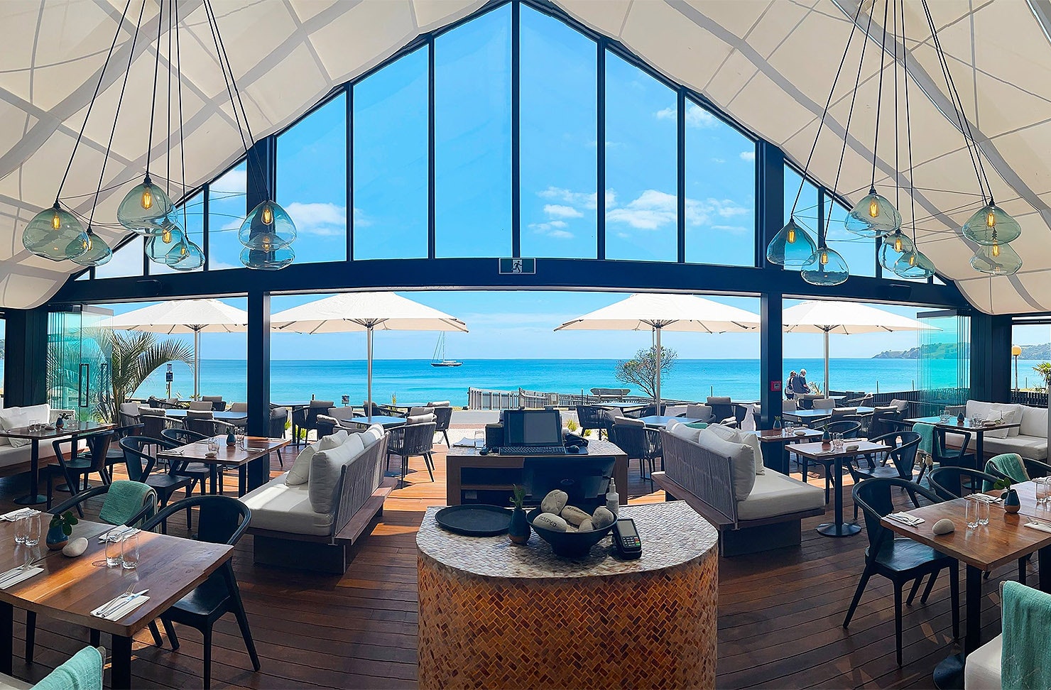 The interior of Ki Māha looks out over the sea.