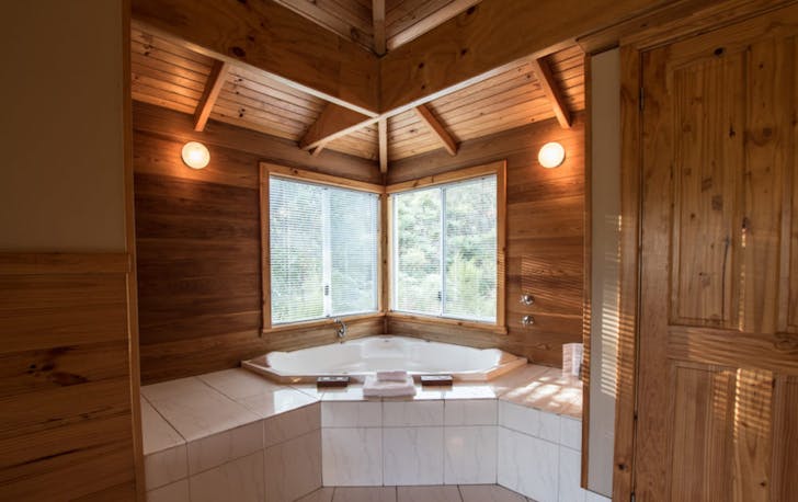The spa bath in Kings Den at Cape Howe Cottages