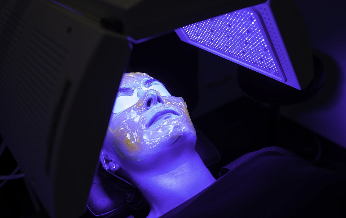 person lies under Kleresca LED lamp