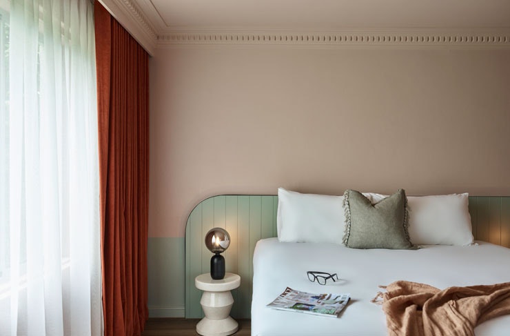 A plush white bed at Kyah Boutique Hotel