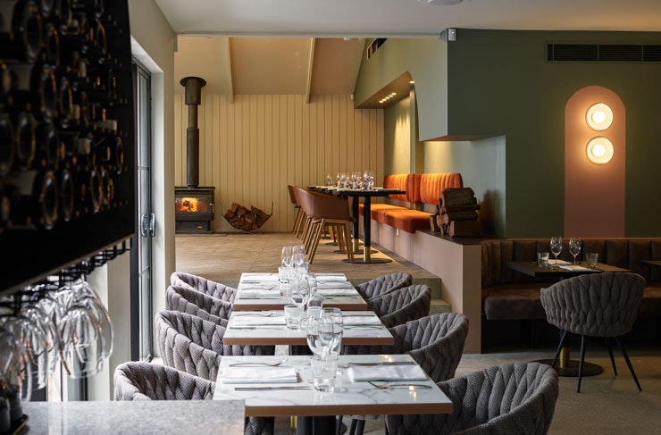 The dining room at Blaq restaurant, with open fireplace