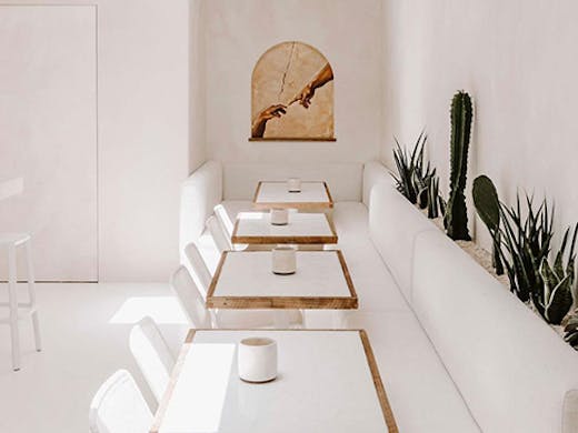 the white interior of a wine bar