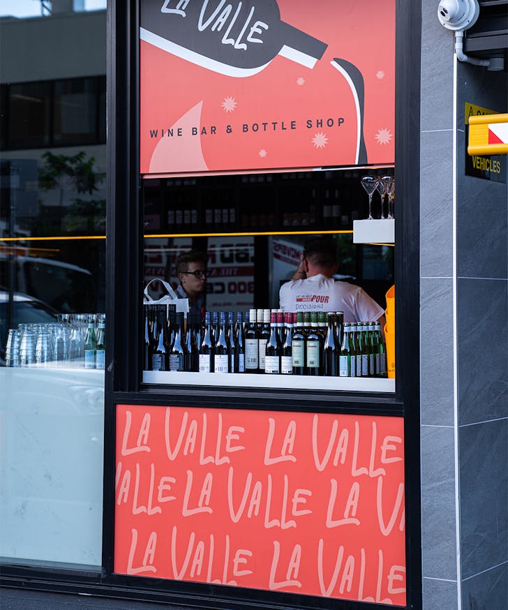 a small takeaway window into a wine shop