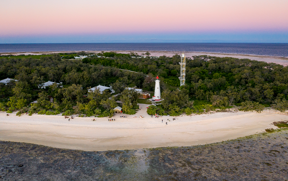 Queensland island Lady Elliot Island seen from the air under a pink sky