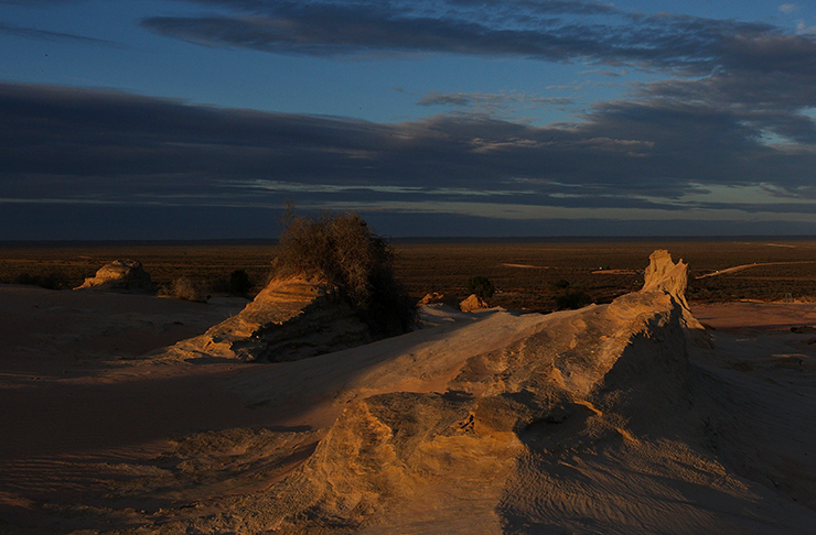 The sun setting over Lake Mungo's towering rock formations.