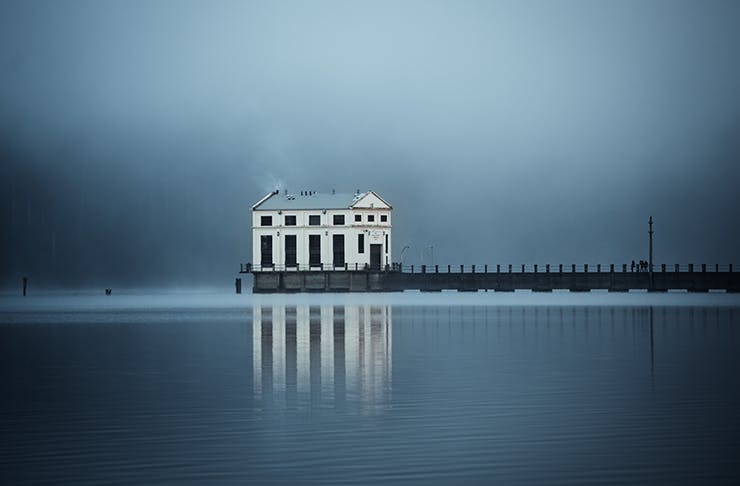 Pumphouse Point Hotel which sits above Lake St Clair on a misty morning.