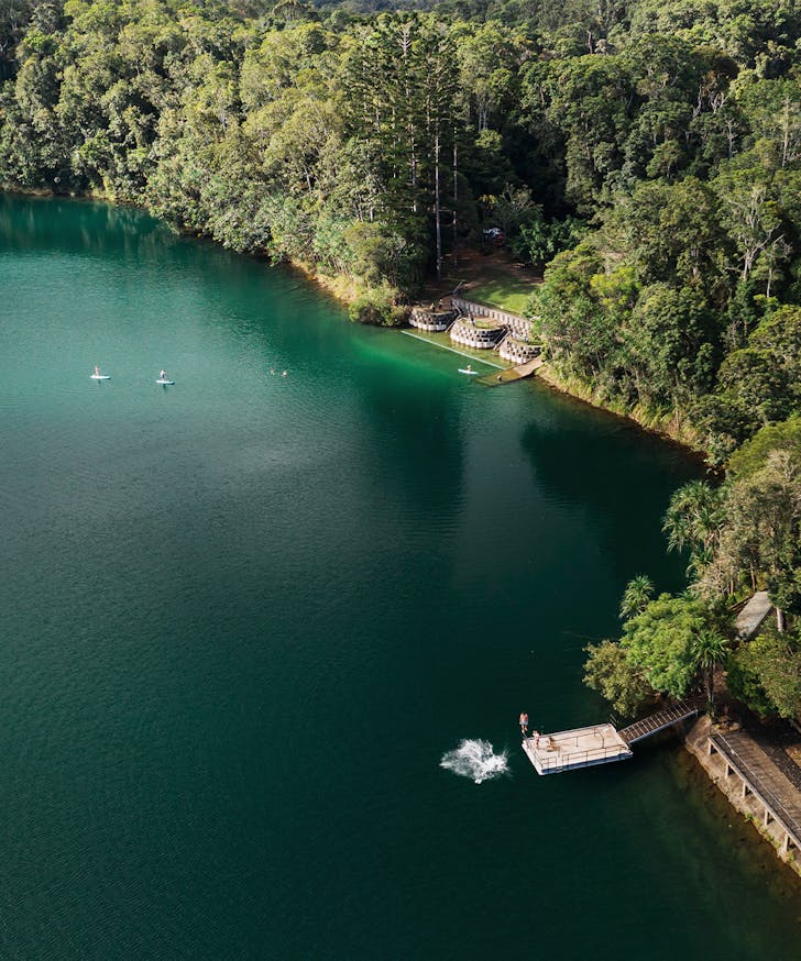 a large lake with a swimming platform