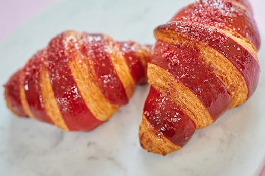Two raspberry croissants.
