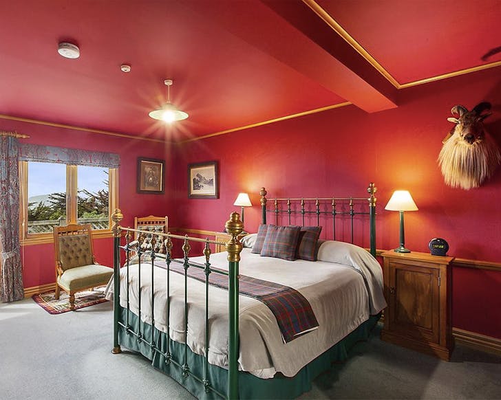 A stately red room at Lanarch Lodge in Dunedin.