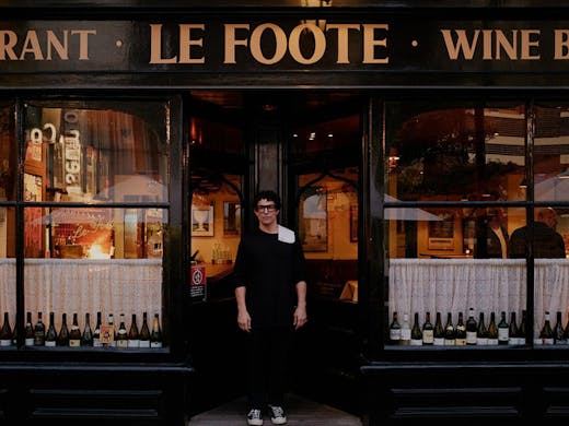 A person stands out front of Le Foote restaurant in The Rocks. 