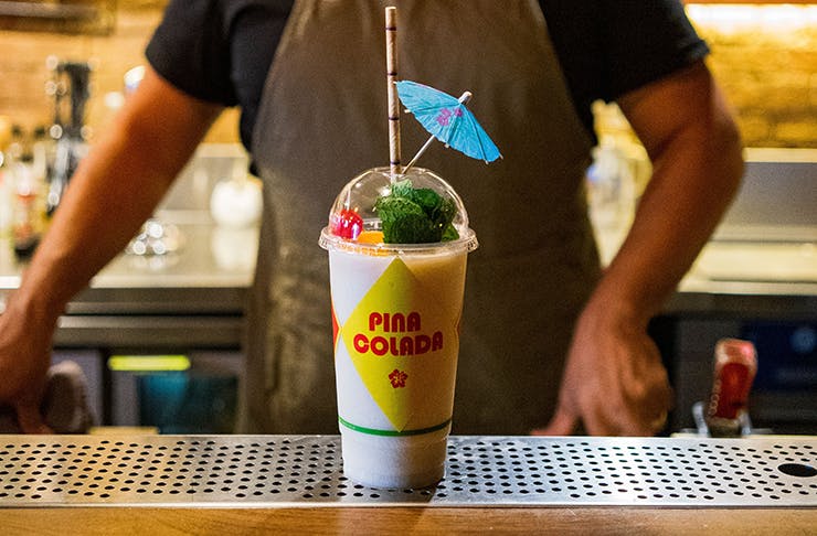 A takeaway smoothie cup with the words 