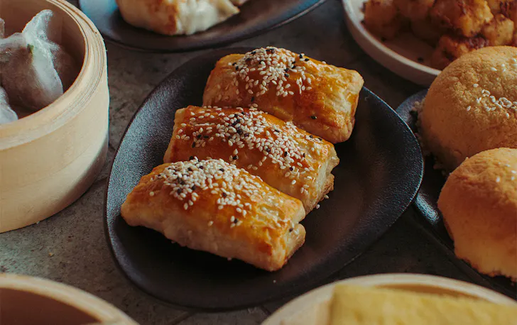 a plate of wrapped rolls