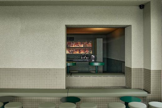a green tiled bar area at Los in Fortitude Valley