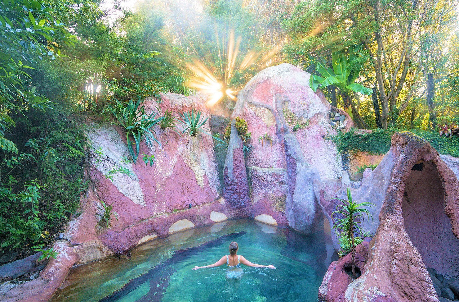 A person basks at the Lost Spring in The Coromandel, one of the best things to do in The Coromandel.