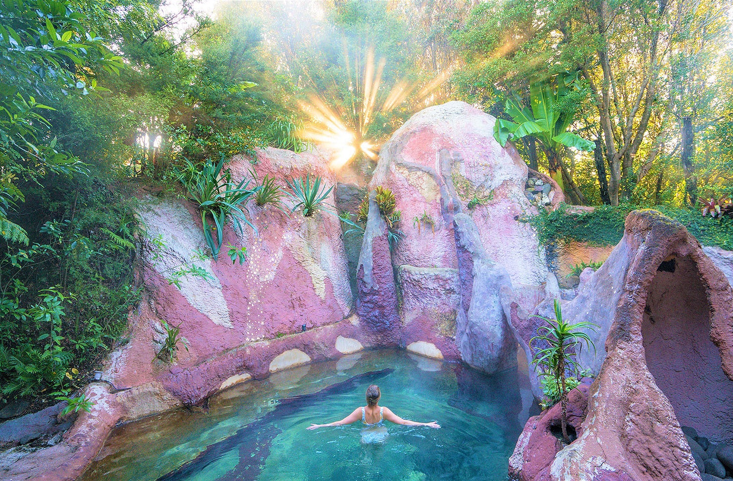 A person basks at the Lost Spring in The Coromandel, one of the best things to do in The Coromandel.