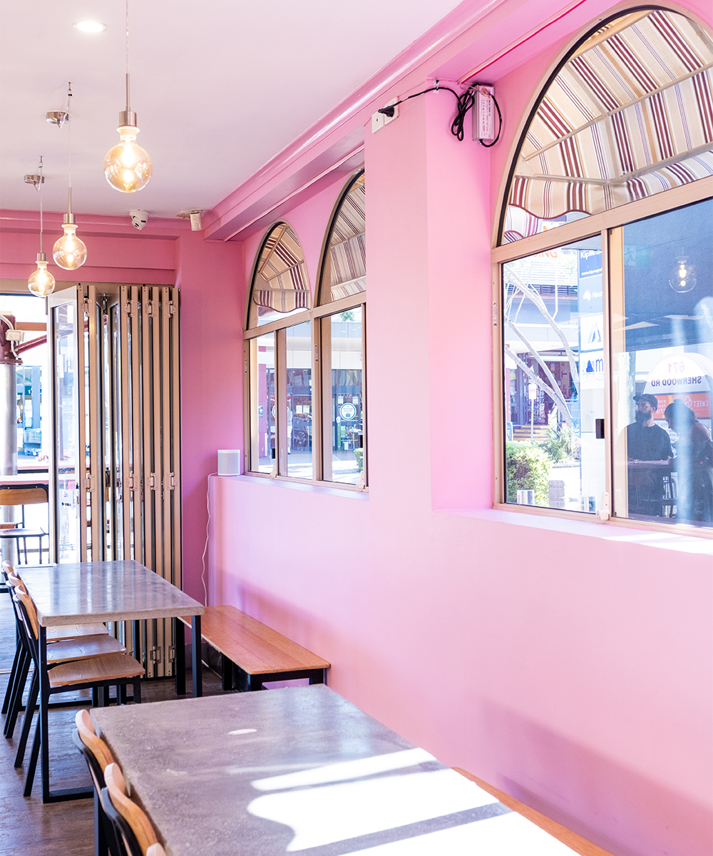 pink interiors and arched windows with awnings at lost palms