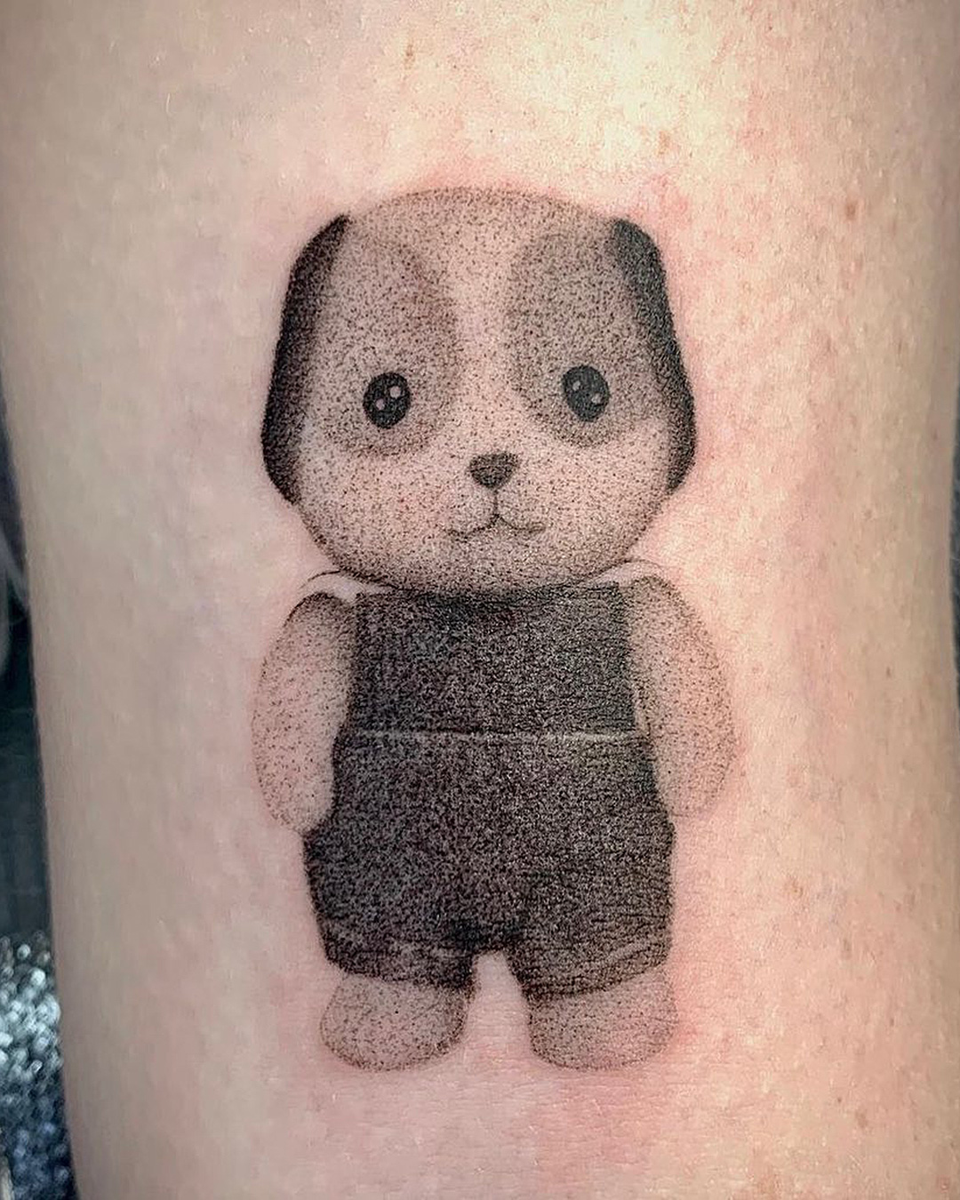 Someone with a cute teddybear tattoo at Love and Hope tattoo.