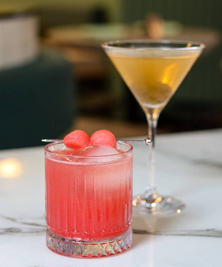 two cocktails standing side by side