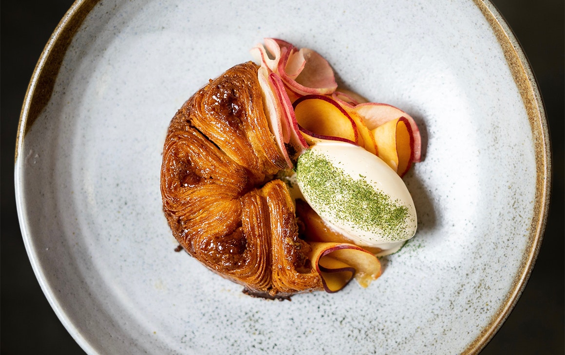 a croissant-like dish on a plate