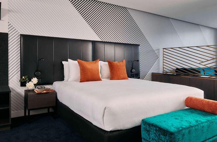 A king-size bed at one of Melbourne's most luxurious hotels, Movenpick.