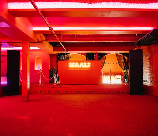 A dance floor with cherry red walls at Maali in Sydney