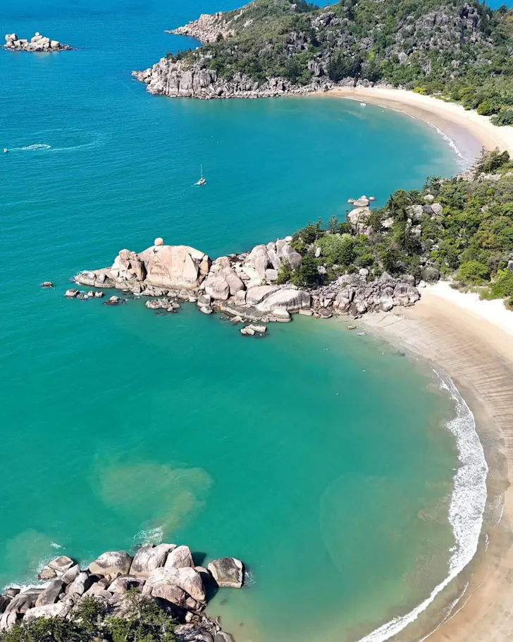 An overhead photo of two secluded crescent beaches on Magnetic Island. 