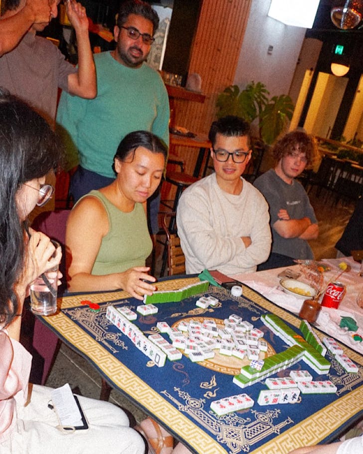 Young people enjoy Mahjong at a Lucky Tiles night.