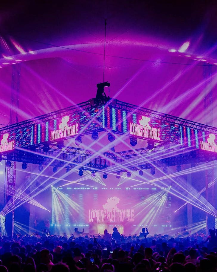 MALL GRAB performs his high-production show to a massive purple-lighted crowd.