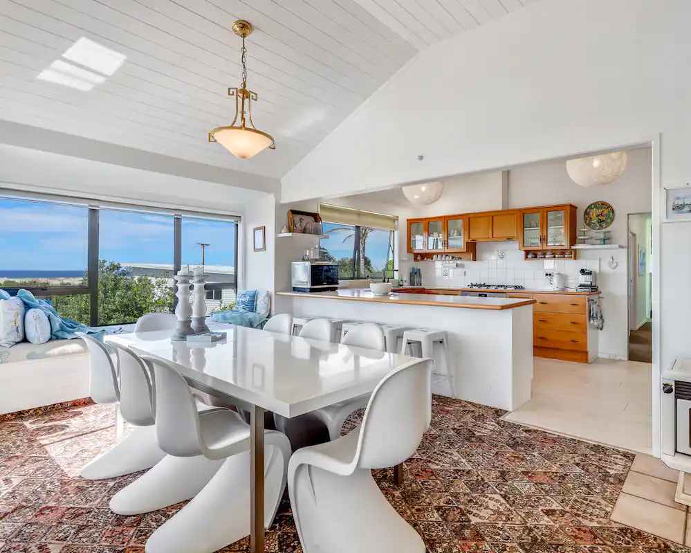 The bright modern shared kitchen with views looking over Mangawhai Harbour