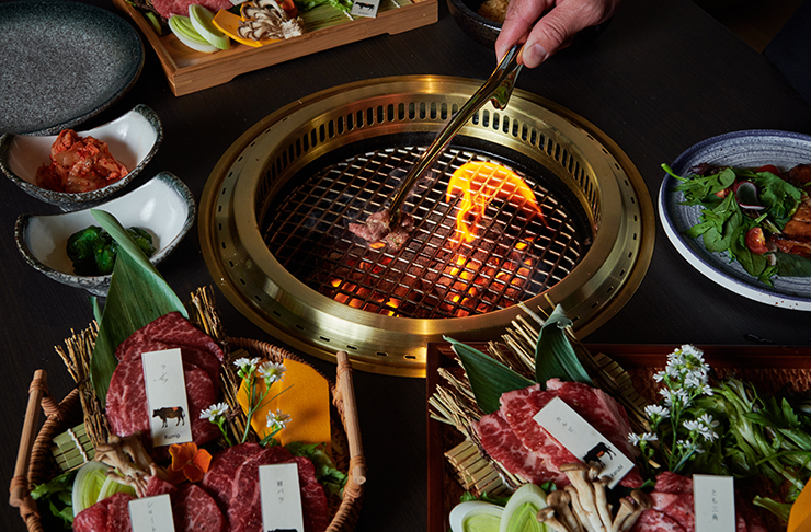 A grill cooking high-grade wagyu steak.