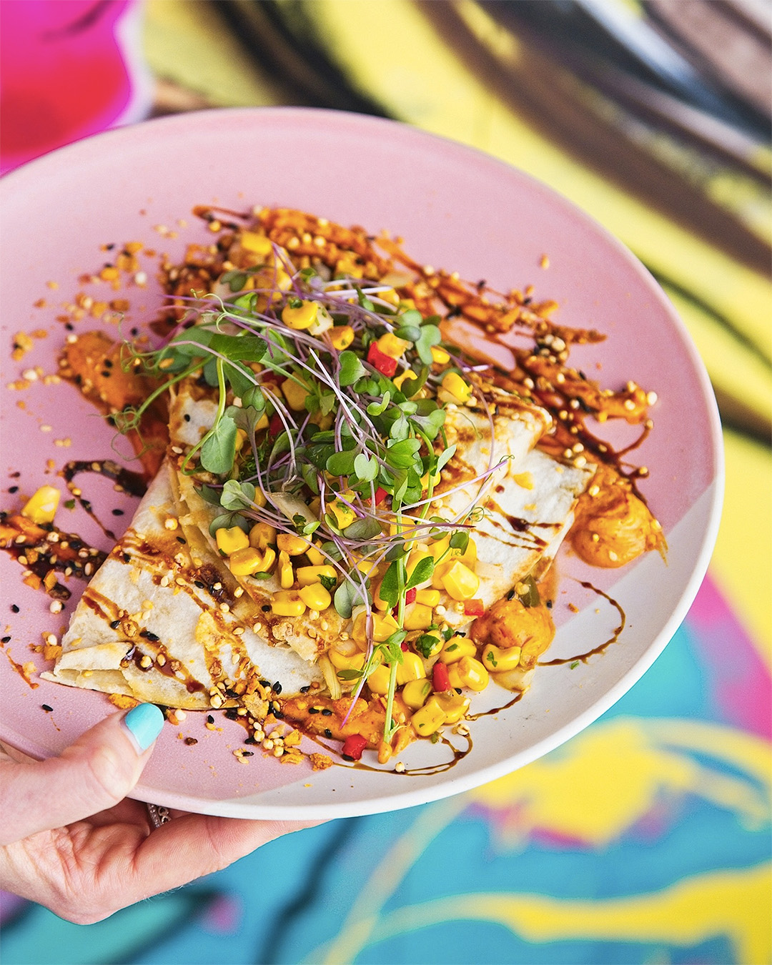 Wild Mushroom Quesadilla packed with Spinach, Chipotle Spiked Raglan Coconut Yoghurt, Corn Salsa and Soy Caramel on a plate at Margo's