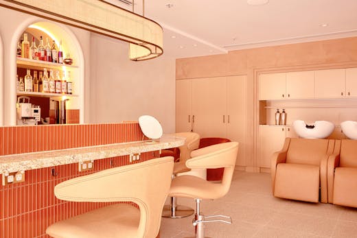 The peach-coloured cocktail bar and wash basins at Mary Kieth Beauty Bar Sydney
