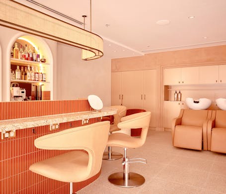 The peach-coloured cocktail bar and wash basins at Mary Kieth Beauty Bar Sydney