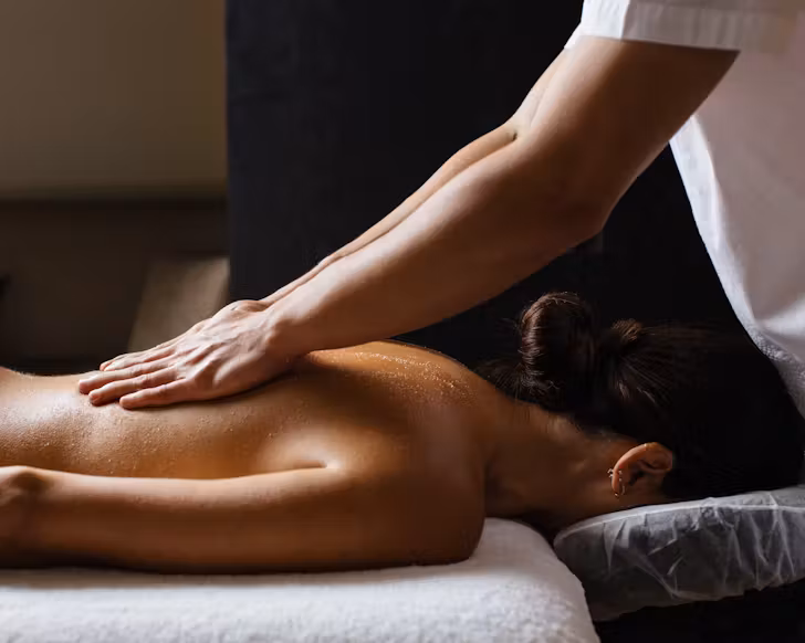 Someone enjoying a back massage at COMO Shambhala Urban Escape in Perth