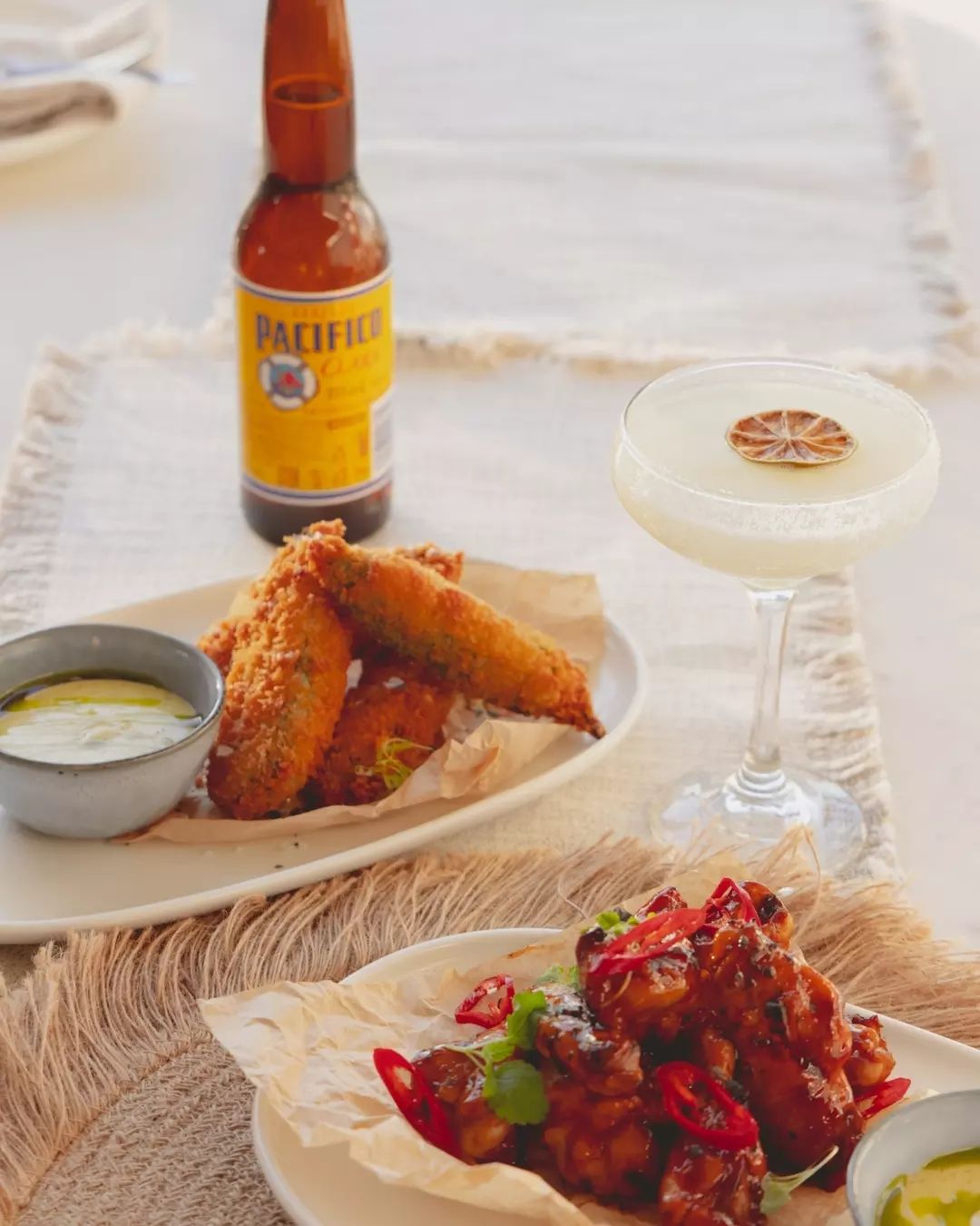 a plate of wings and other mexican street food at one of the best mexican restaurants in brisbane, Maya