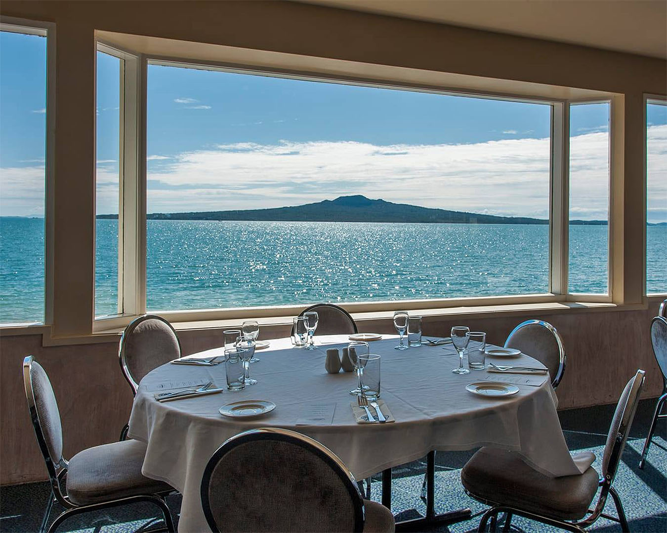 McHugh's Of Cheltenham's stunning dining room looks out to Rangitoto.