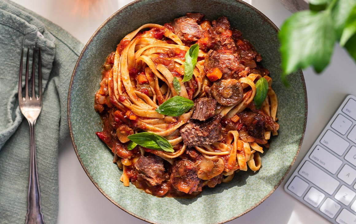a bowl of spaghetti and meatballs