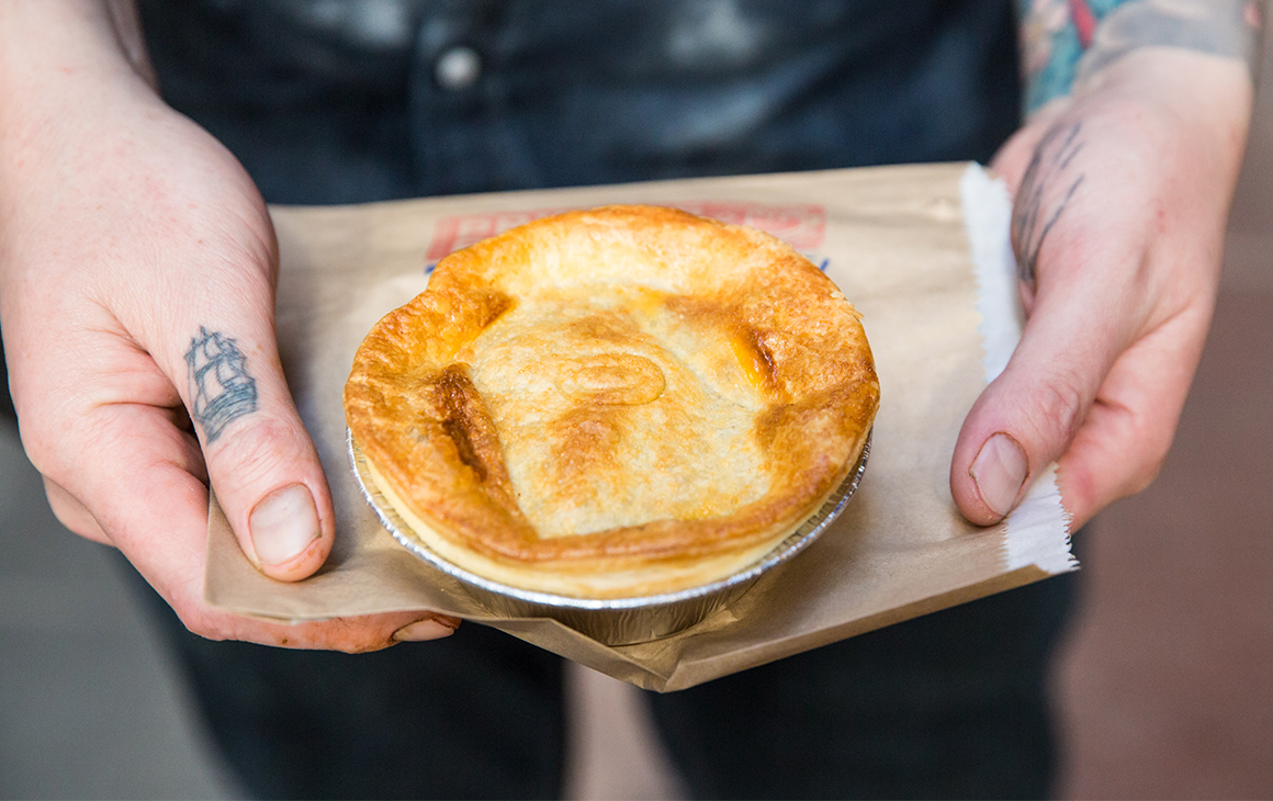 a meat pie on a paper bag