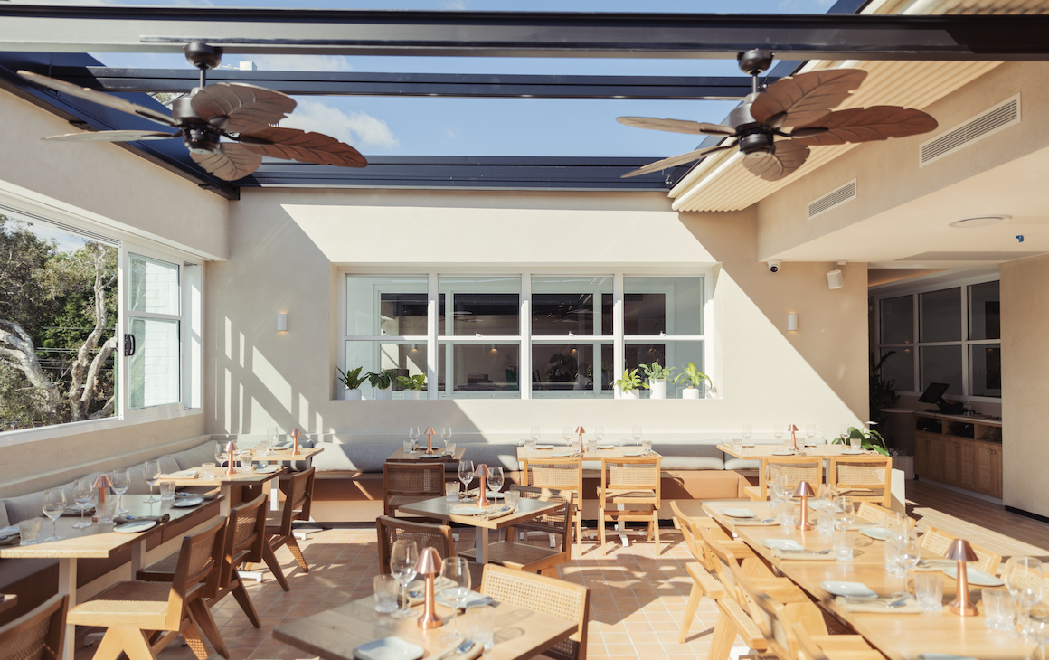 a light and airy rooftop dining space 