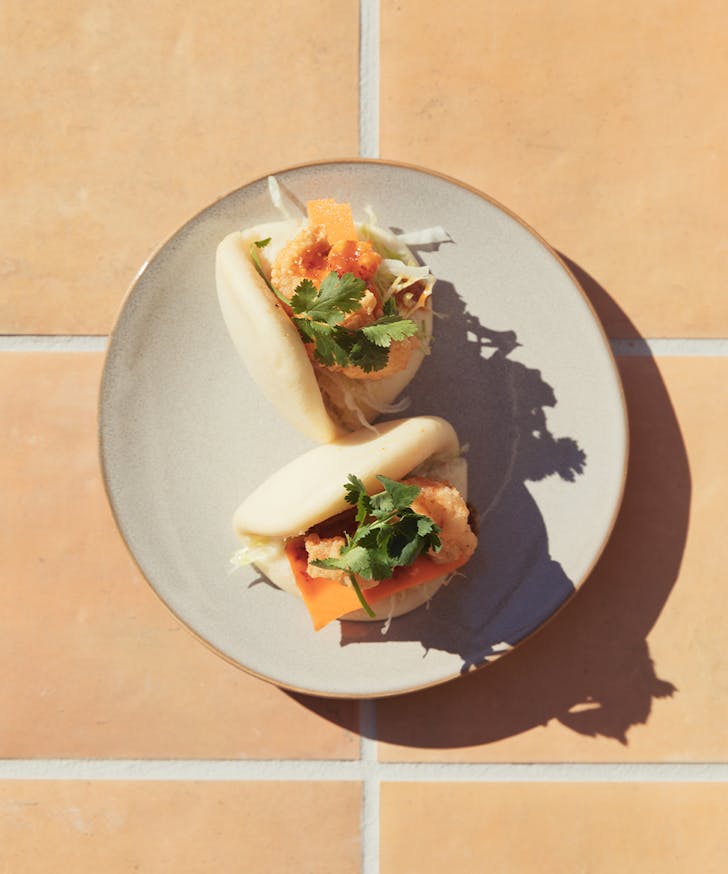 a plate of bao buns