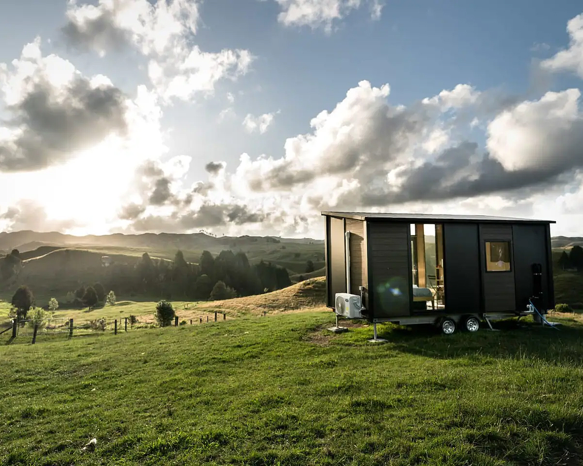 The Mighty Tiny House farm stay in Waikatio, atop a hill overlooking the farm and fields.